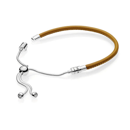 SILVER SLIDING BRACELET WITH GOLDEN TAN BRACELET AND CLEAR CUBIC ZIRCONIA