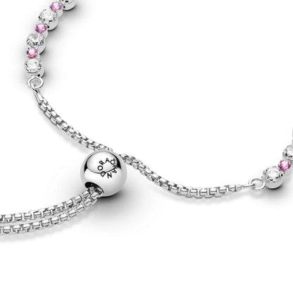 Rhodium plated sterling silver slider bracelet with clear cubic zirconia and synthetic pink sapphire