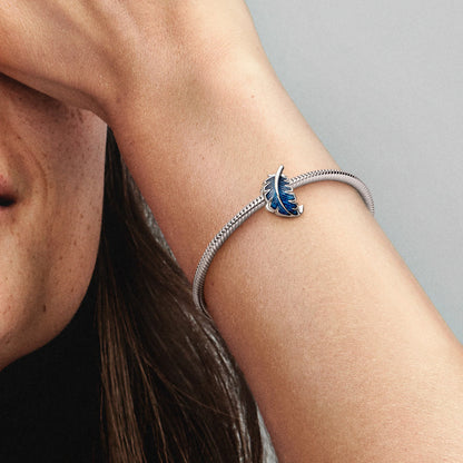 Feather Sterling Silver Charm With Transparent Blue Enamel